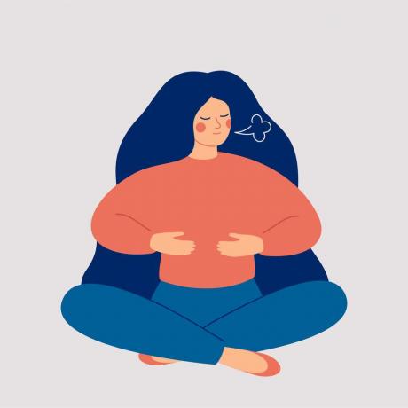 महिला सांस लेने का व्यायाम करती है लड़की फर्श पर कमल की मुद्रा में बैठती है और गहरी सांस लेती है बीमारी के बाद श्वसन प्रणाली को ठीक करती है स्वास्थ्य और भलाई की अवधारणा